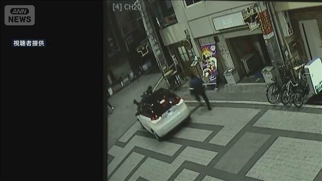 検問中の警察官をボンネットから振り落とし逃走　大阪