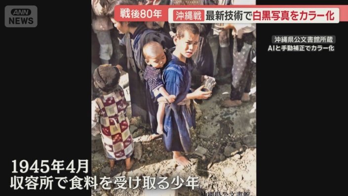 アメリカ軍から食料を受け取る少年